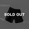 Hands holding House of Exploration Jersey Shorts Front with Sold Out text in white