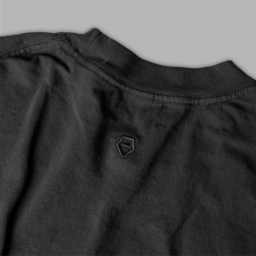 house-of-exploration-t-shirt-close-up-on-wandrd-logo