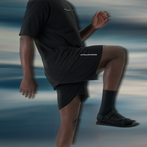 lifestyle-image-of-man-wearing-the-h-o-e-limited-edition-jersey-shorts-image-blurred